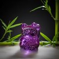 Statuetta viola del gatto portafortuna
